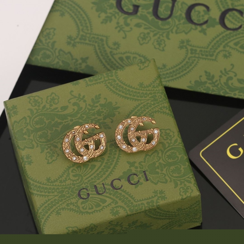 G*u*i earrings